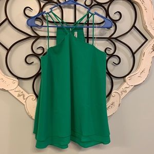 Never been worn. Women’s strappy shirt. Super cute